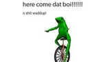 Green 3D frog riding a unicycle with one arm outstretched, captioned "here come dat boi!!!!!!" and "o shit waddup!"