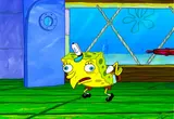 Cartoon sponge hunched in a chicken pose with bulging eyes and bent arms, standing on green grass outside a blue door