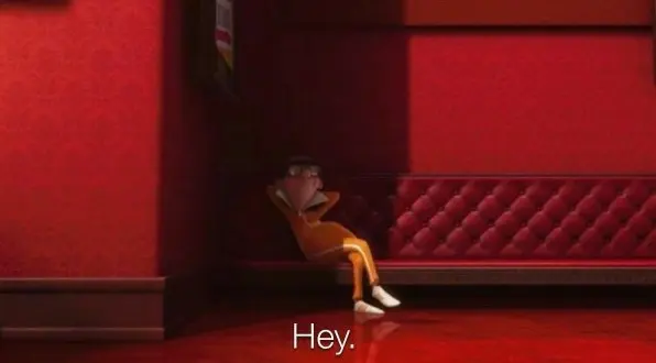 Orange-tracksuited cartoon man in glasses slouched against a red wall and sofa, subtitled "Hey."