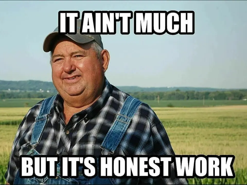 Older man in a cap, plaid shirt and denim overalls in a farm field, captioned 'It ain't much but it's honest work'