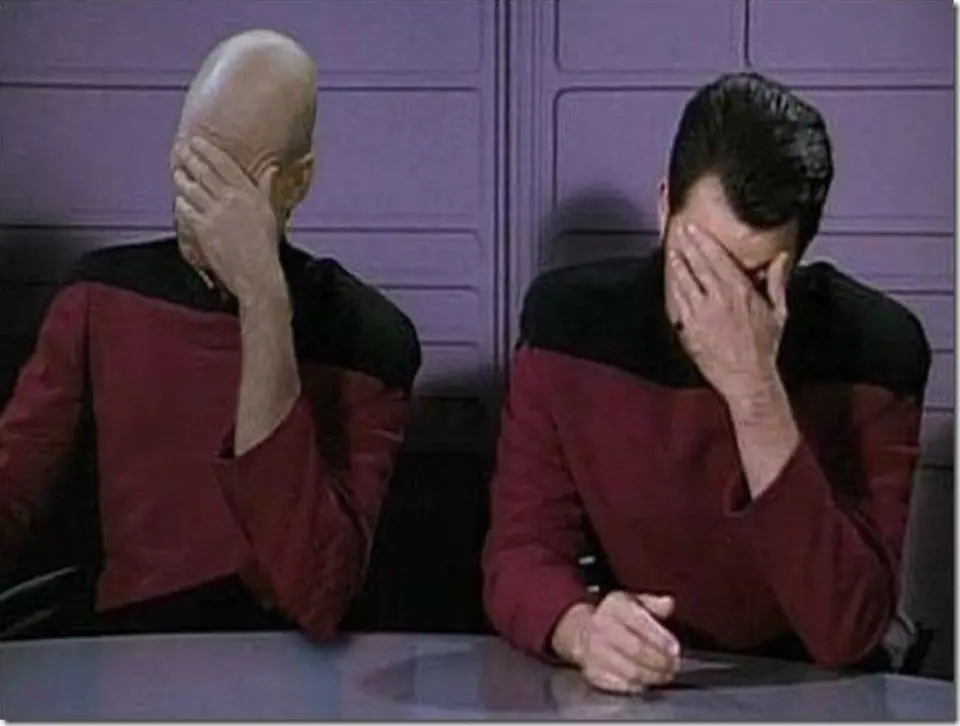 Star Trek's Captain Picard and Commander Riker each covering their face in a double facepalm