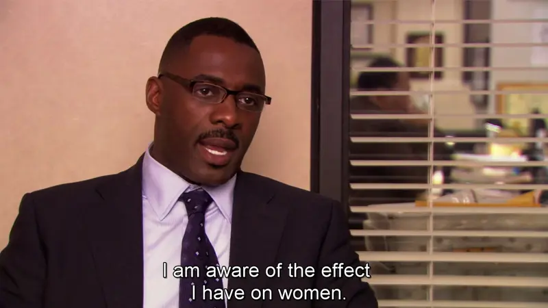 Man in a suit and patterned tie in an office, subtitled "I am aware of the effect I have on women."