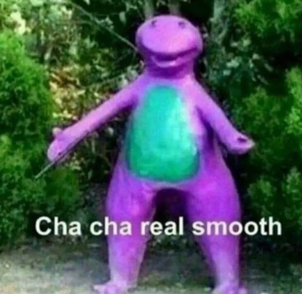 Crudely painted purple dinosaur statue standing in bushes with arms outstretched, captioned "Cha cha real smooth"