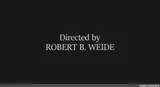Dark end-credits card with white serif text reading "Directed by ROBERT B. WEIDE", small site watermark at bottom right