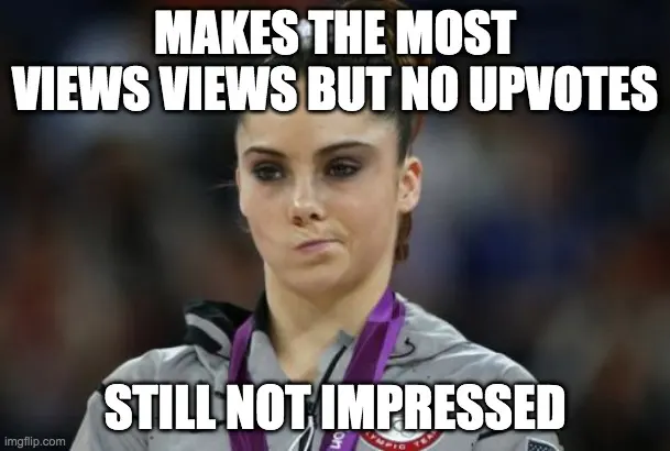Gymnast wearing a medal with pursed lips, captioned "MAKES THE MOST VIEWS VIEWS BUT NO UPVOTES" and "STILL NOT IMPRESSED"