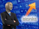 Meme Man in a suit in front of a rising stock chart labeled STONKS
