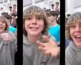 The '6-7 kid' grinning straight into the camera in a packed gym while making the 6-7 hand gesture
