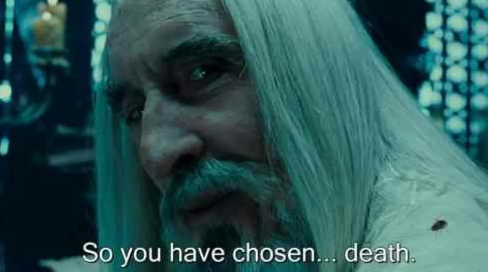 Film still of a long white-haired, bearded wizard in dim blue light, subtitled "So you have chosen... death."