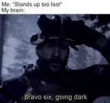 Bearded soldier lowering night-vision goggles in a dark forest, subtitled "bravo six, going dark," under a joke about standing up fast