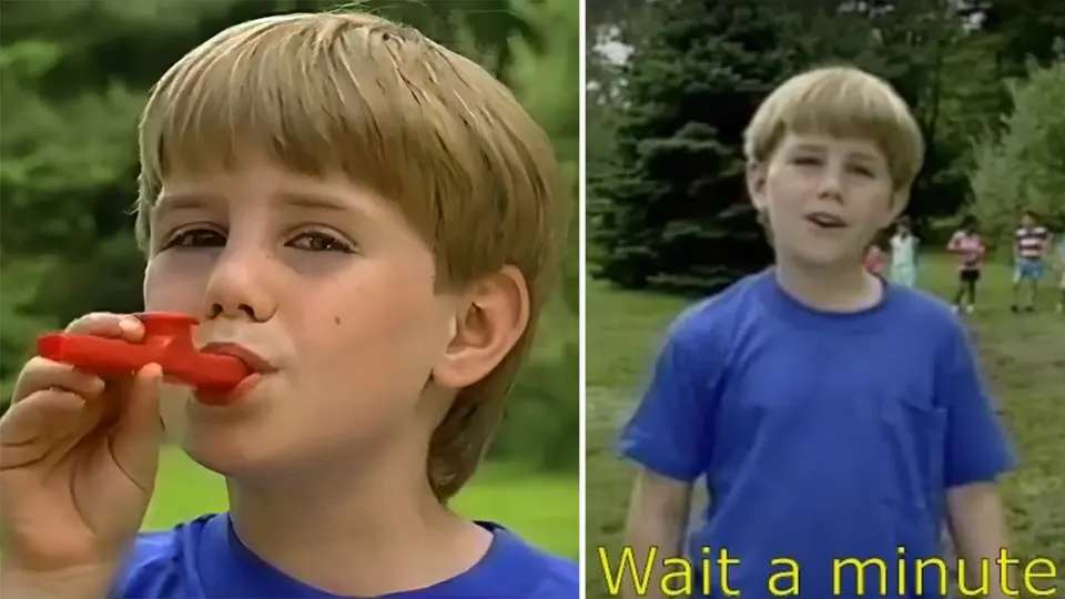 Two stills of a blond boy in a blue T-shirt playing a red kazoo and speaking outdoors, subtitled "Wait a minute"