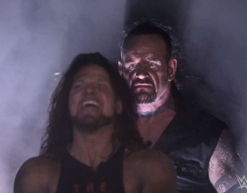 Undertaker Standing Behind AJ Styles meme